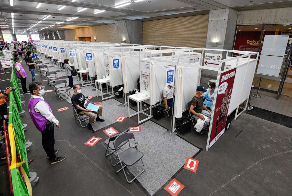 PHOTO: People receive the Pfizer COVID-19 vaccine at the Noevir Stadium Kobe in Kobe, western Japan, May 31, 2021.