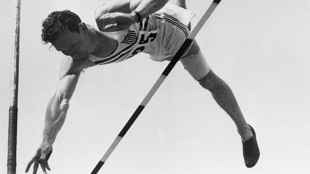 PHOTO: FILE - The Rev. Bob Richards of the US team eases over the bar to set a new record for the Olympics pole vault.