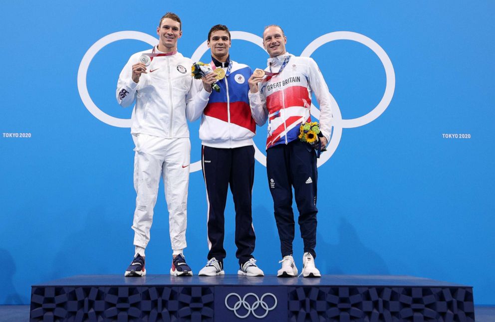 PHOTO: Silver medalist Ryan Murphy of the US, gold medalist Evgeny Rylov of Team ROC and bronze medalist Luke Greenbank of Great Britain pose during the medal ceremony for the Men's 200m Backstroke Final at the 2020 Olympic Games in Tokyo, July 30, 2021.