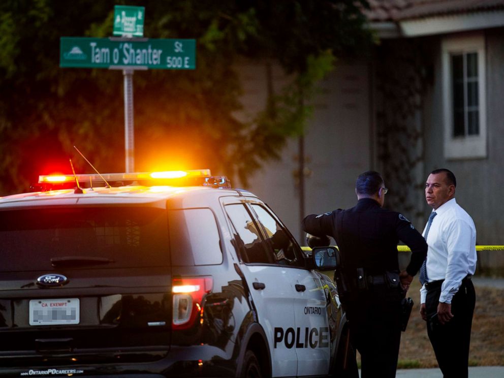 PHOTO: Ontario's police stand outside the stage where two children, a baby and a teenager, were found dead with their mother, who was not reacting, in a house on the 20th. August 2019, in Ontario, California. 