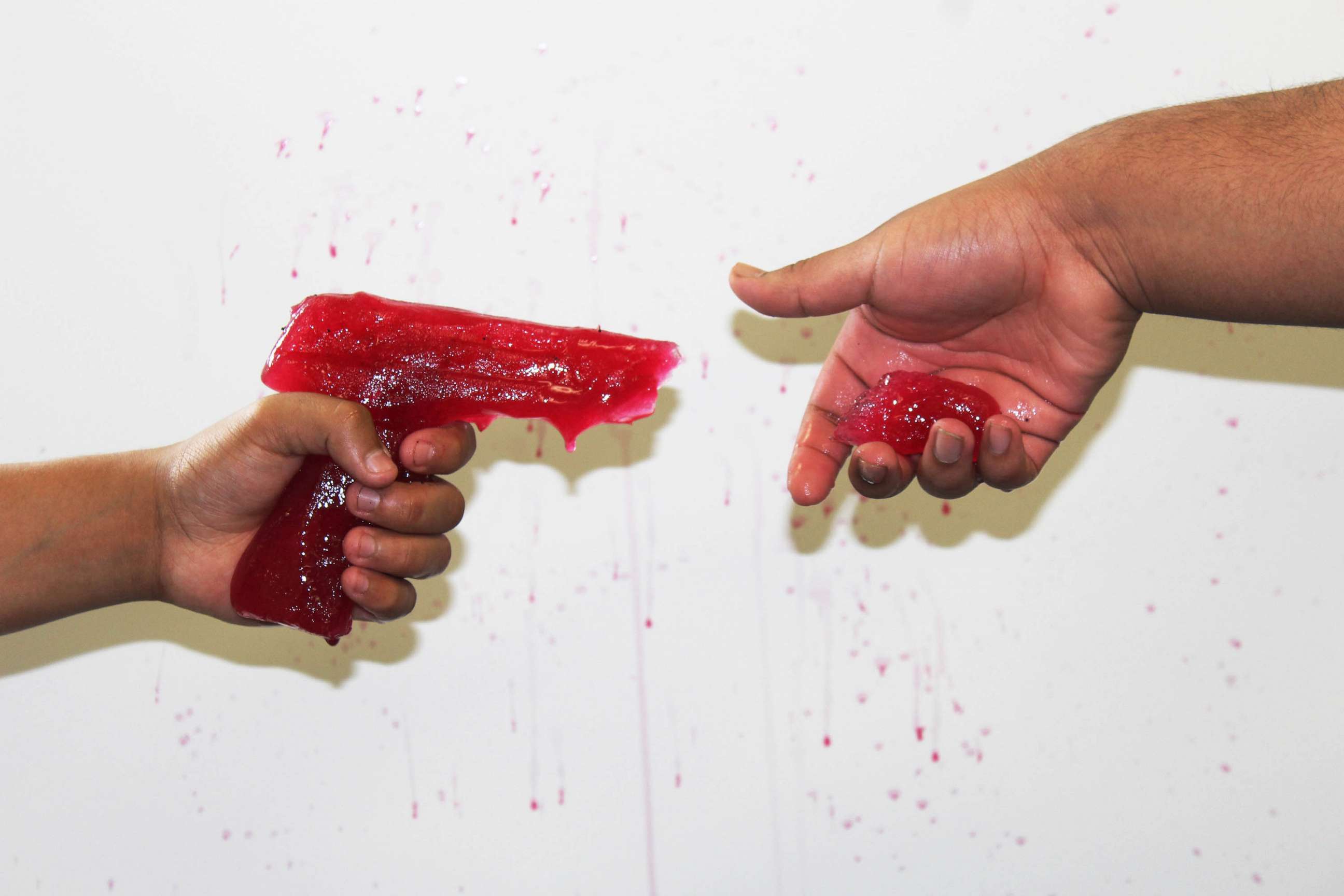 PHOTO: Artists created this image using a red-colored ice sculpture made from the mold of a disabled gun.