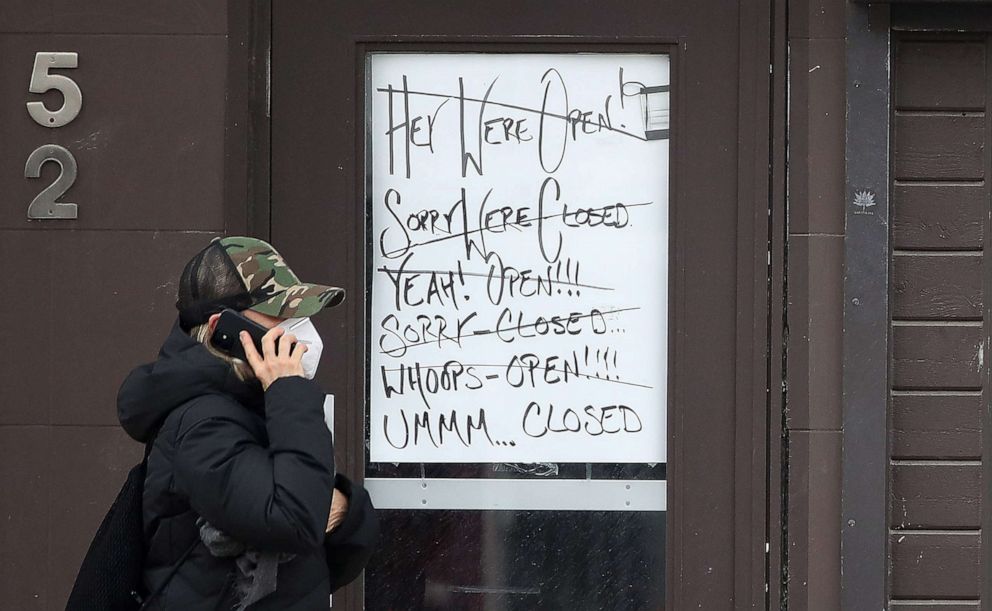 PHOTO: A sign in a window of a business expresses frustration with lockdowns, April 5, 2021, in Ontario, Canada.