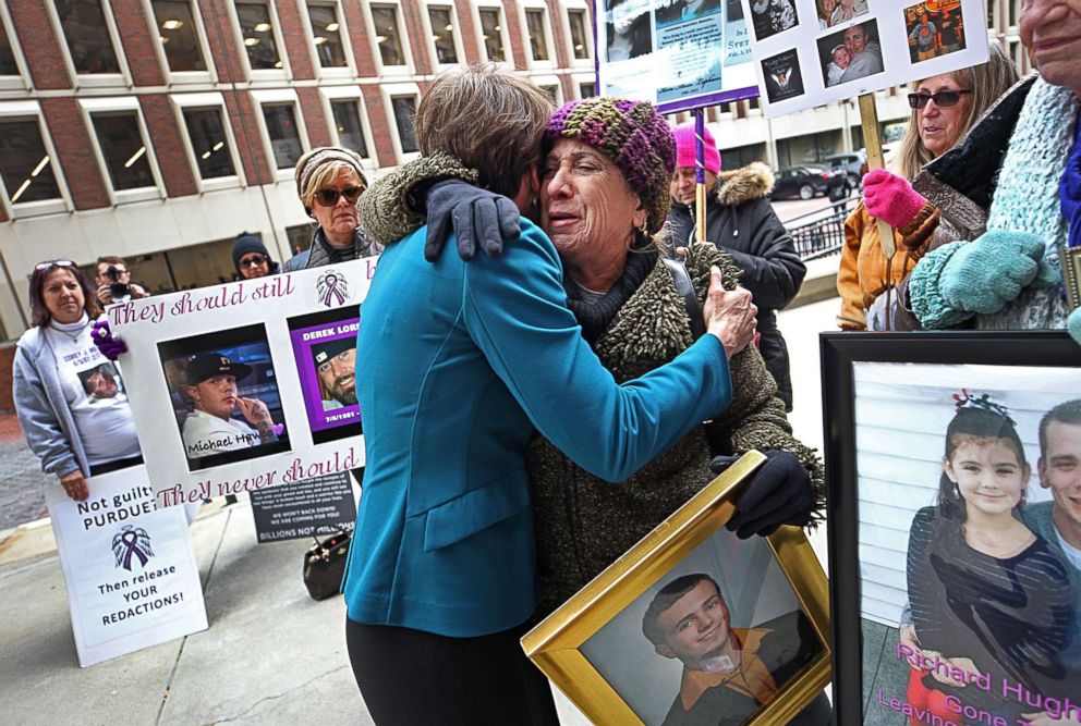 PHOTO: Paula Haddad, whose son Jordan died from opioids at the age of 26, receives a hug outside the Suffolk Superior Court in Boston, Jan. 25, 2019.