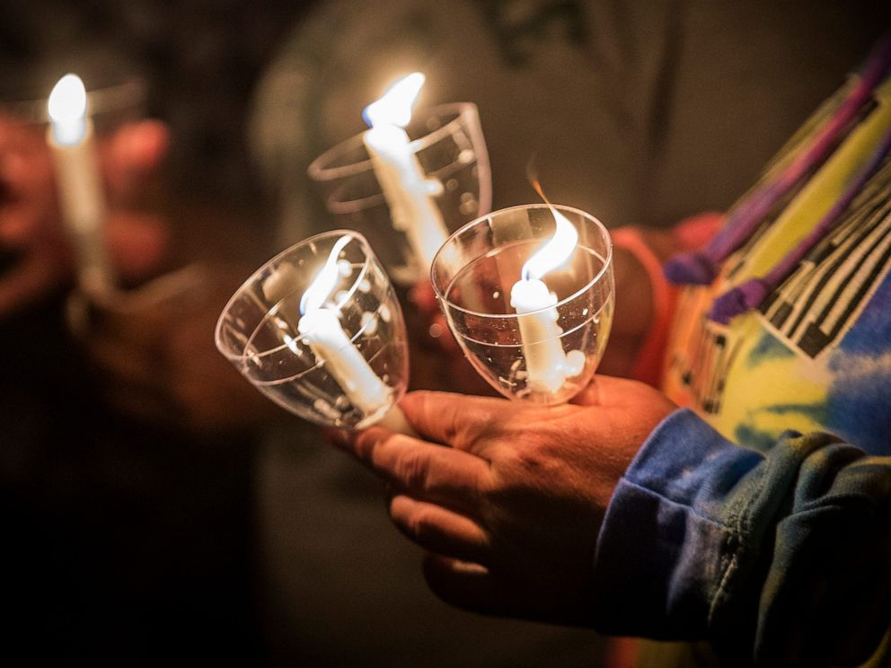 PHOTO: Community members gather outside of a church in Muncie, Ind., on Aug. 31, 2019, for a candle-light vigil to remember those who died of opioid overdoses in 2019.