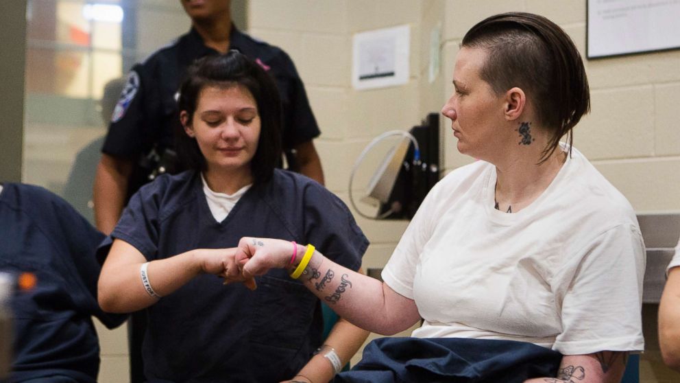 Sisters Stephanie, 25, left, and Tera Crowder, 33, reconnect in jail while battling opioid addiction and attending the Heroin Addiction Recovery Program (HARP) in Chesterfield County Jail, near Richmond, Va. 