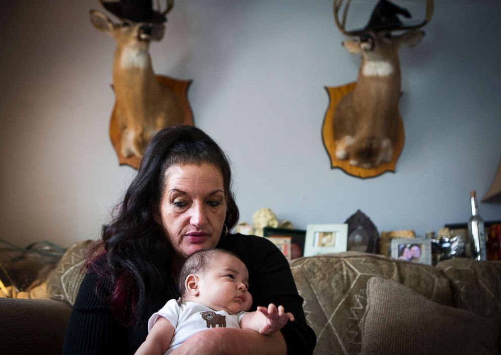 PHOTO: Deborah Crowder holds her youngest grandson, Jaydain, at a friend's house in early November. Deborah has custody of her oldest daughter, Tera's four children. Jaydain was born while Tera was in jail.