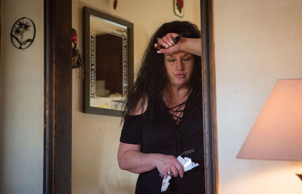 PHOTO: Deborah Crowder catches her breath as her youngest grandson, Jaydain, starts crying. Deborah has custody of four of her grandsons whose mother is in jail. The house can be exhausting, "I haven't had my house to myself in 12 years," she said.