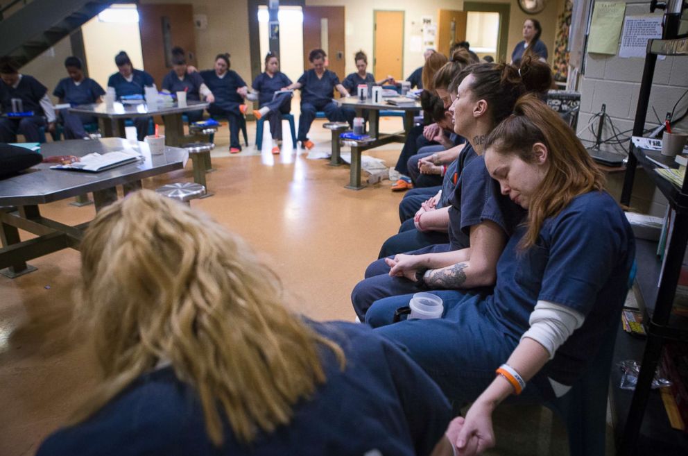 PHOTO: The Harpettes pray for a fellow participant who has just learned that her cousin was shot and not likely to survive, Dec. 14, 2017.