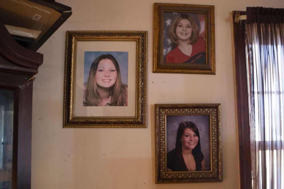 PHOTO: Portraits of Tera, left, and Stephanie, bottom right, taken when they were in high school, hang on the wall of their mother's home in Chesterfield. "They were beautiful girls," Deborah Crowder said.