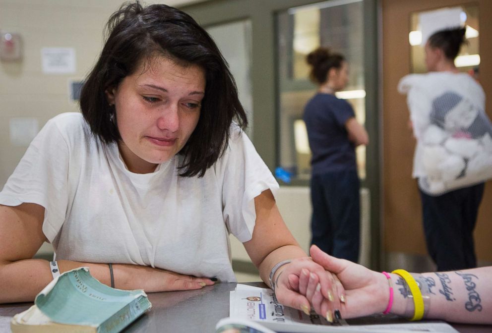 PHOTO: Stephanie holds her sister Tera's hand as she talks about her troubles adjusting in the HARP program.