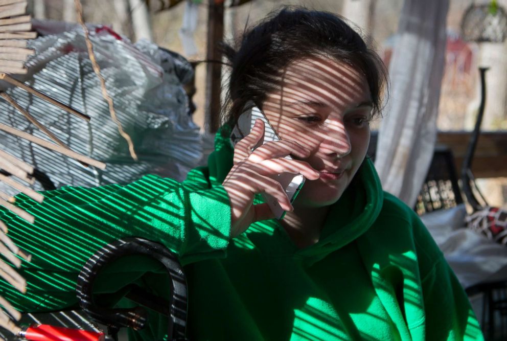 PHOTO: Stephanie borrows her mother's phone to make a call about an hour after being released from jail, Jan. 27, 2018.