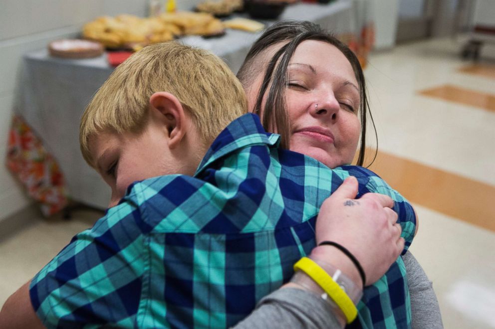 PHOTO: Tera Crowder hugs her son James, 7, during a special face-to-face visit on Thanksgiving at the Chesterfield County Jail. 