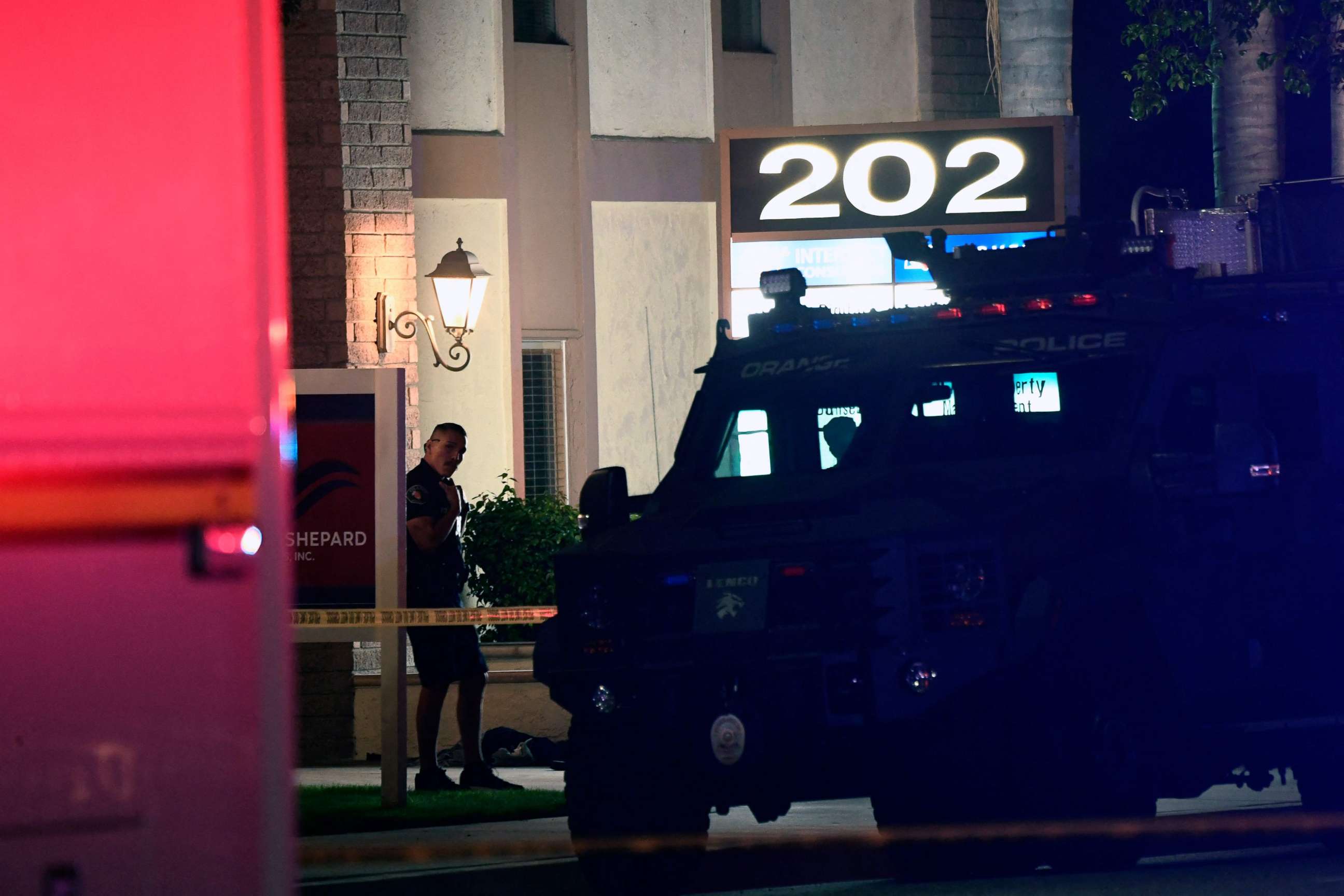 PHOTO: A police officer stands outside a building were multiple people were killed in a shooting in Orange, Calif., on March 31, 2021.