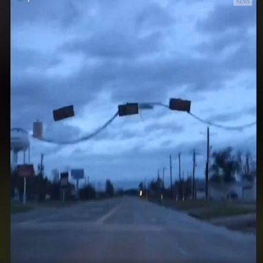 Damaged traffic lights, downed trees and other debris scattered throughout Orange, Texas, reveal the destructive path of Hurricane Laura.