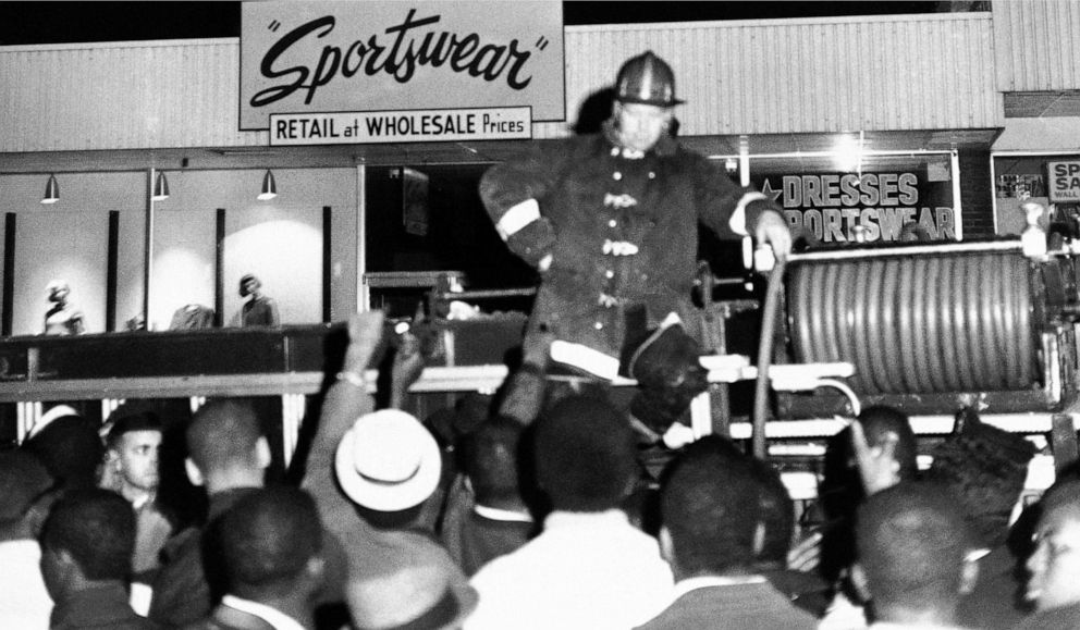 PHOTO: A fireman stands ready for action as Black students from South Carolina State College heckle him during an attempt to integrate a private bowling alley, Feb. 7, 1968 in Orangeburg, S.C.