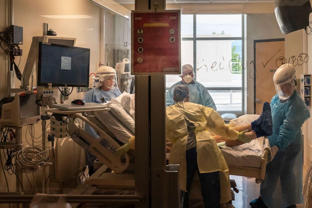 PHOTO: Medical staff in the COVID-19 Intensive Care Unit at Three Rivers Asante Medical Center treat a patient on Sept. 9, 2021, in Grants Pass, Ore.