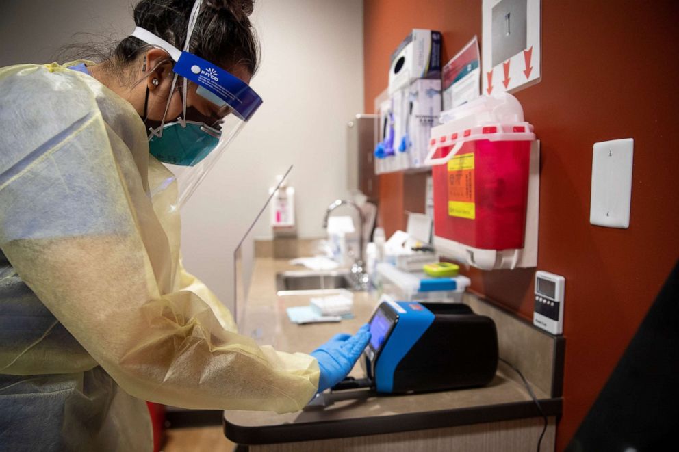 PHOTO: Medical Assistant Melissa Estrada prepares a COVID-19 antigen test at Lancaster Family Health Center in Salem, Ore., Aug. 19, 2021.