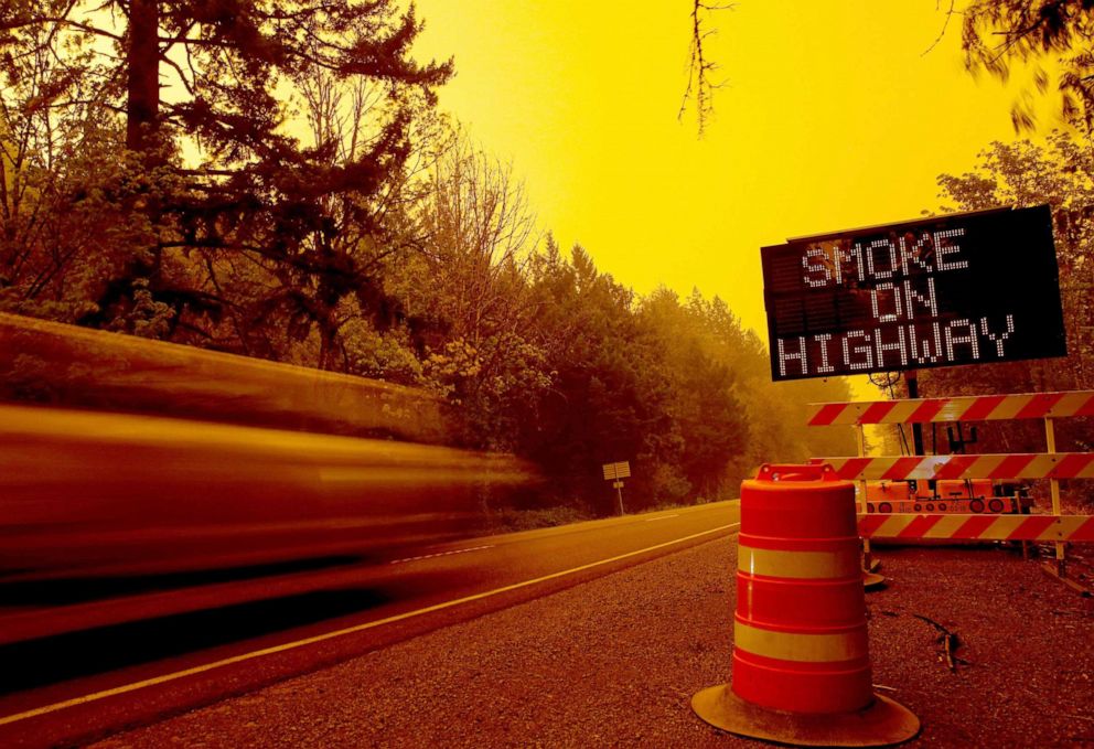 PHOTO: Smoke from the Lionshead Fire and Beachie Creek Fire create an orange glow as an "extremely critical" fire warning  is issued on Monday, Sept. 7, 2020 on U.S. Highway 20 near Gates, Ore.

Wildfire370