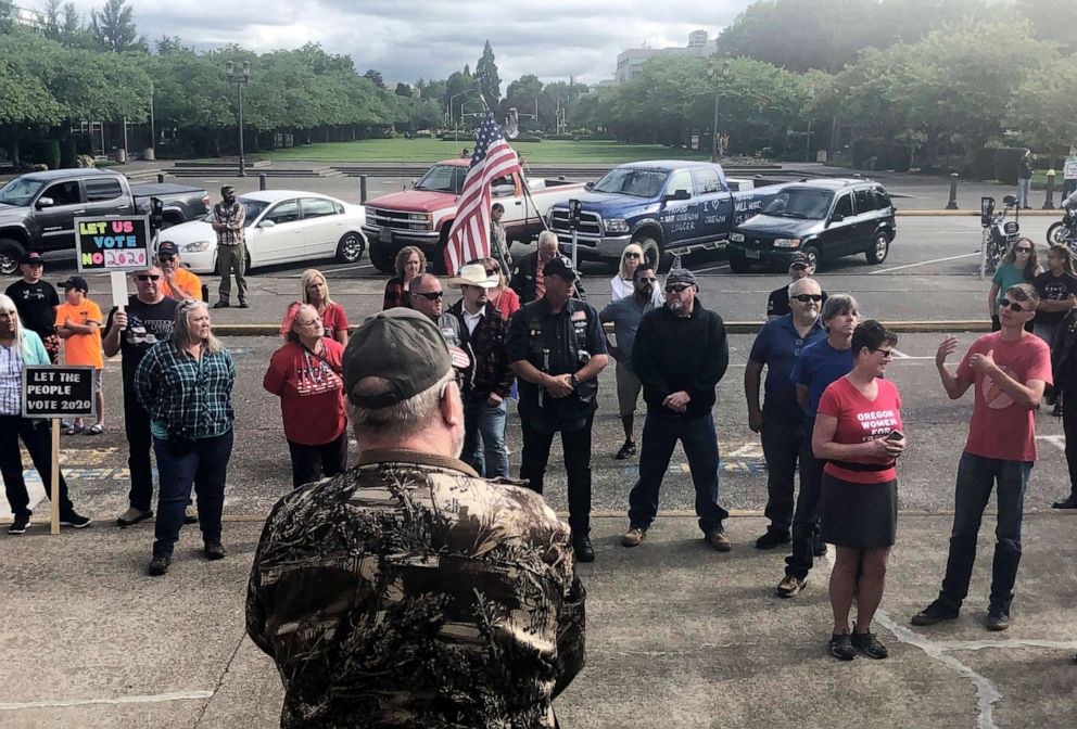 PHOTO: A small crowd of local Republicans show their support of a Republican walkout outside the Oregon State Capitol in Salem, Ore., June 23, 2019.