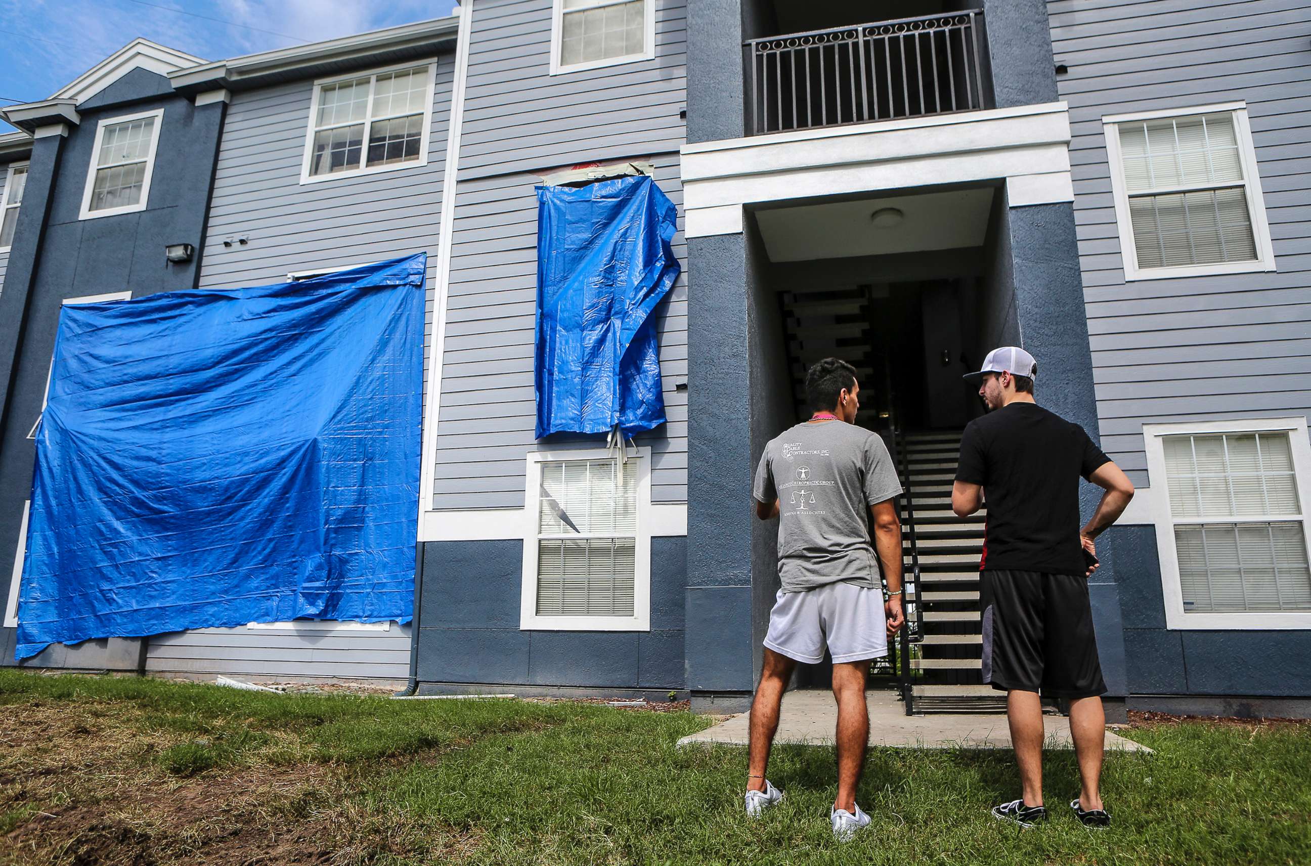 PHOTO: Residents at Westbrook Apartments get a first look at their building where a gunman held four children hostage before taking their life and his own, June 12, 2018, in Orlando, Fla.