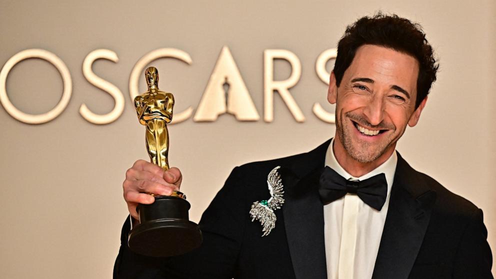 PHOTO: Adrien Brody, winner of the Best Actor in a Leading Role for The Brutalist poses in the press room during the 97th Annual Oscars, Mar. 2, 2025, in Los Angeles.