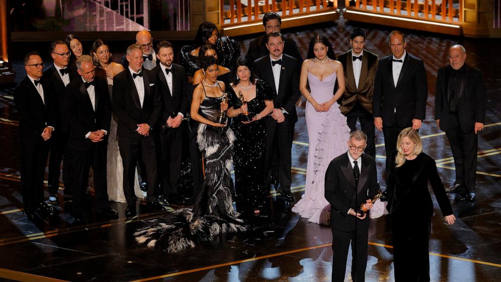 PHOTO: Director Paul Thomas Anderson and the cast and crew celebrate as they accept the Oscar for Best Picture for "One Battle after Another" at the 98th Academy Awards, March 15, 2026 in Hollywood, Calif.
