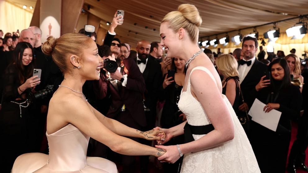 PHOTO: Ariana Grande and Elle Fanning attend the 97th Annual Oscars, Mar. 2, 2025 in Los Angeles.