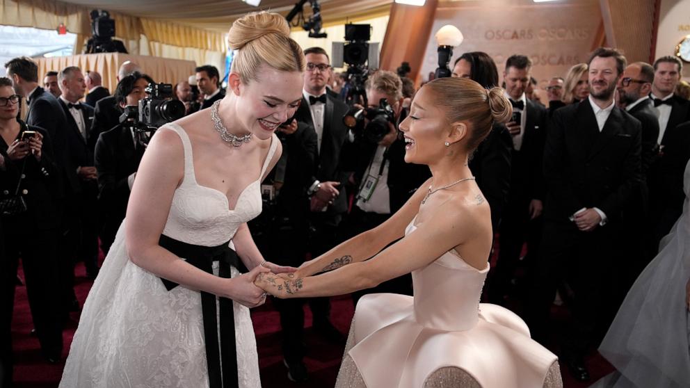 PHOTO: Ariana Grande and Elle Fanning attend the 97th Annual Oscars, Mar. 2, 2025 in Los Angeles.