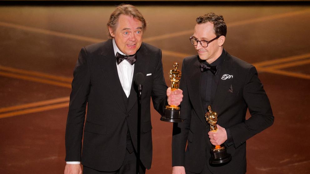 PHOTO: Chris Lavis and Maciek Szczerbowski accept the Oscar for Best Animated Short Film for "The Girl Who Cried Pearls" at the 98th Academy Awards, March 15, 2026 in Hollywood, Calif.