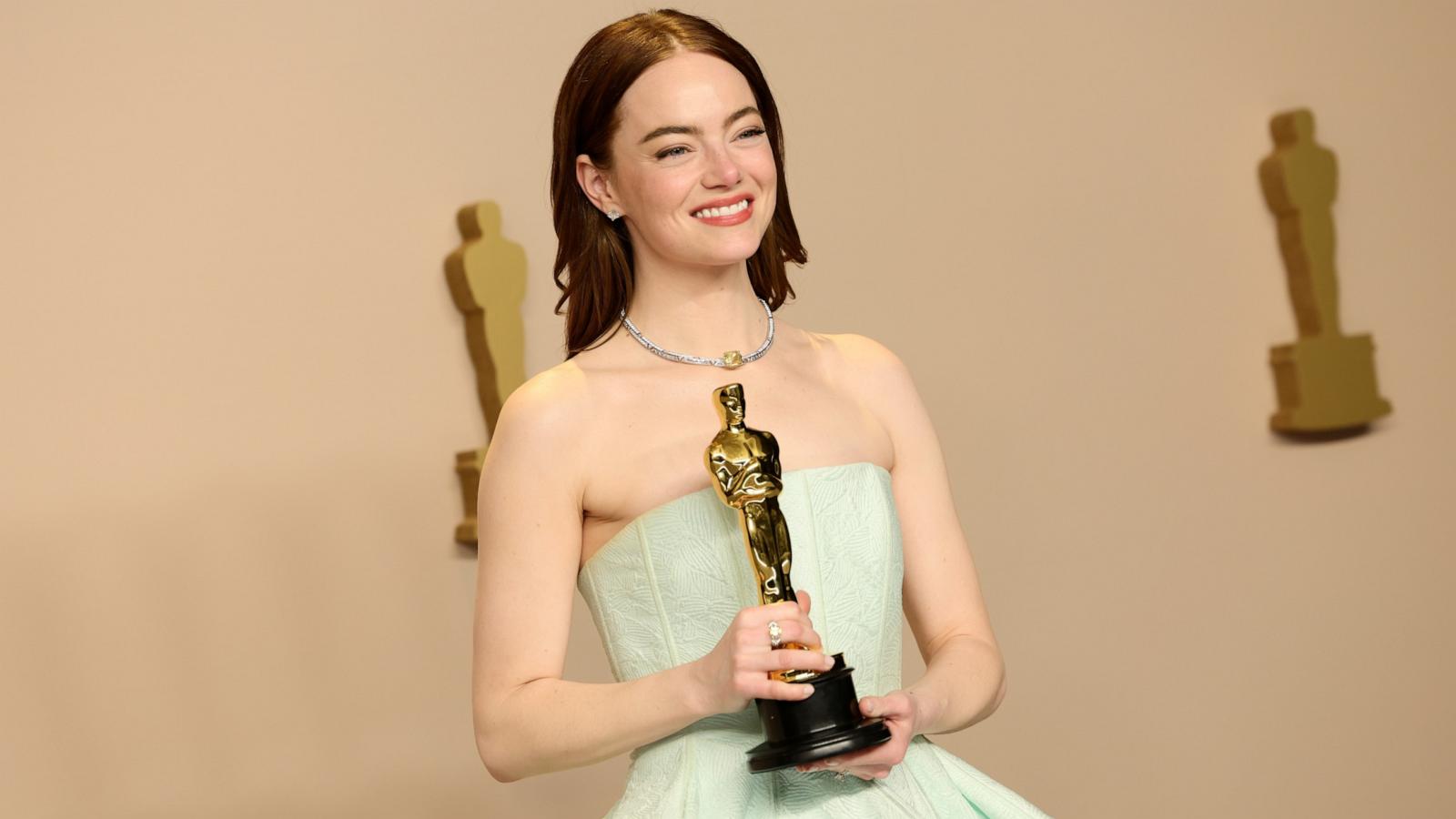 PHOTO: Emma Stone, winner of the Best Actress in a Leading Role award for "Poor Things" poses in the press room during the 96th Annual Academy Awards, Mar. 10, 2024, in Hollywood.