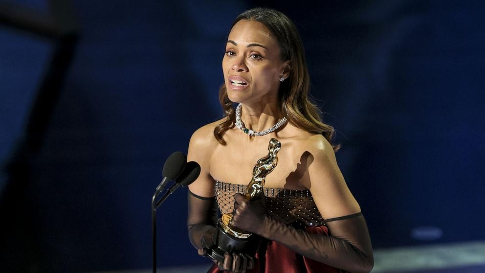 PHOTO: Zoe Saldana accpets the Oscar for Best Actress in a Supporting Role for 'Emilia Perez' during the 97th annual Academy Awards in Los Angeles, Mar. 2, 2025.