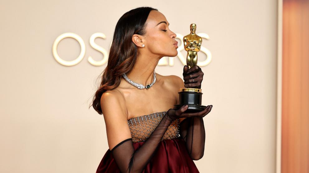 PHOTO: Zoe Saldana, winner of the Best Actress in a Supporting Role poses in the press room during the 97th Annual Oscars, Mar. 2, 2025 in Los Angeles.