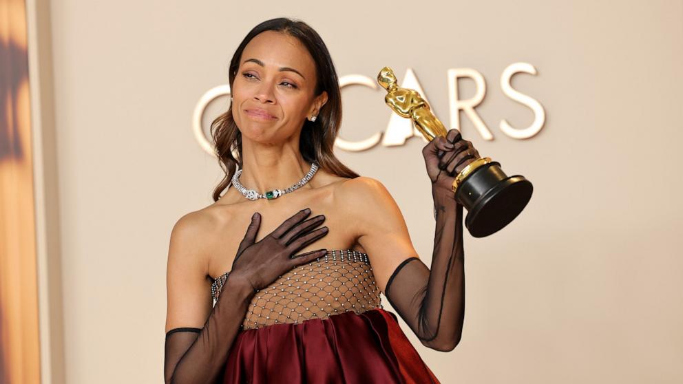 PHOTO: Zoe Saldana, winner of the Best Actress in a Supporting Role poses in the press room during the 97th Annual Oscars, Mar. 2, 2025 in Los Angeles.