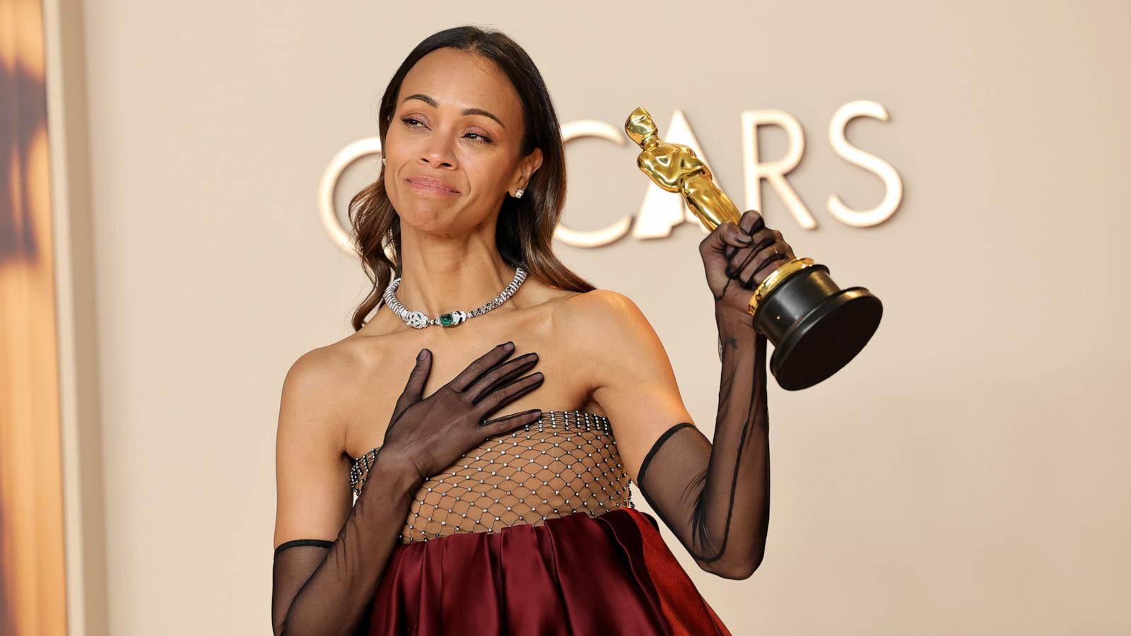 PHOTO: Zoe Saldana, winner of the Best Actress in a Supporting Role poses in the press room during the 97th Annual Oscars, Mar. 2, 2025 in Los Angeles.