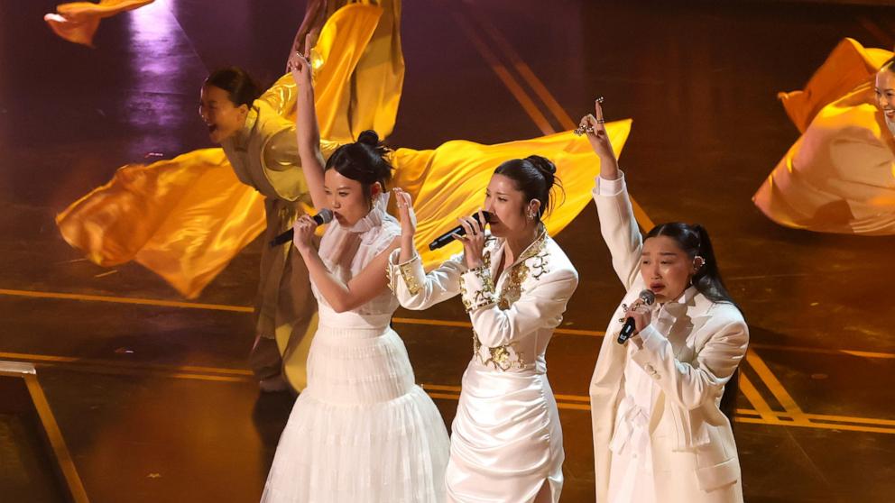 PHOTO: Rei Ami, EJAE, and Audrey Nuna performs on stage at the 98th Academy Awards, March 15, 2026 in Hollywood, Calif.
