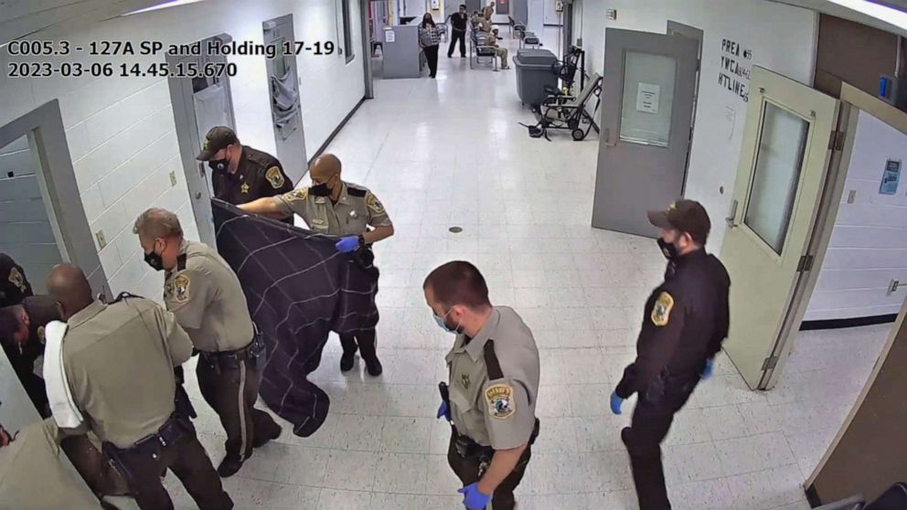 PHOTO: Virginia sheriff deputies work to remove Irvo Otieno from his cell at Henrico County Jail, March 6, 2023.