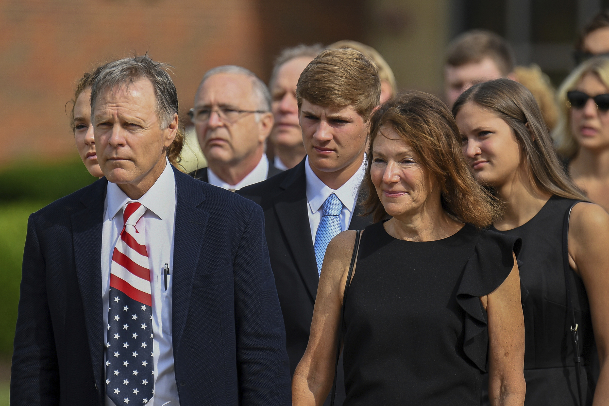 PHOTO: Fred and Cindy Warmbier watch as the casket for their son Otto is placed in a hearse after his funeral in Wyoming, OH., June 22, 2017. 