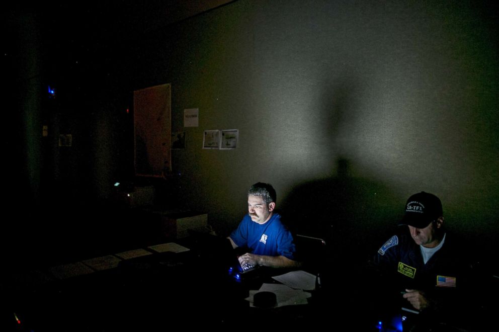 PHOTO: Adam Davis and Travis Warford, technical information specialists with the Federal Emergency Management Agency's Urban Search and Rescue team, in Orlando, Fla., Sept. 10, 2017. 