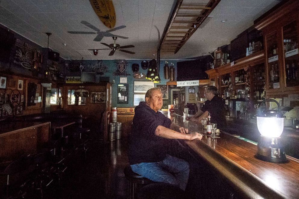 PHOTO: Joseph Pokorski drinks a beer at The Town Square as downtown Sonoma, Calif., remains without power, Oct. 9, 2019.