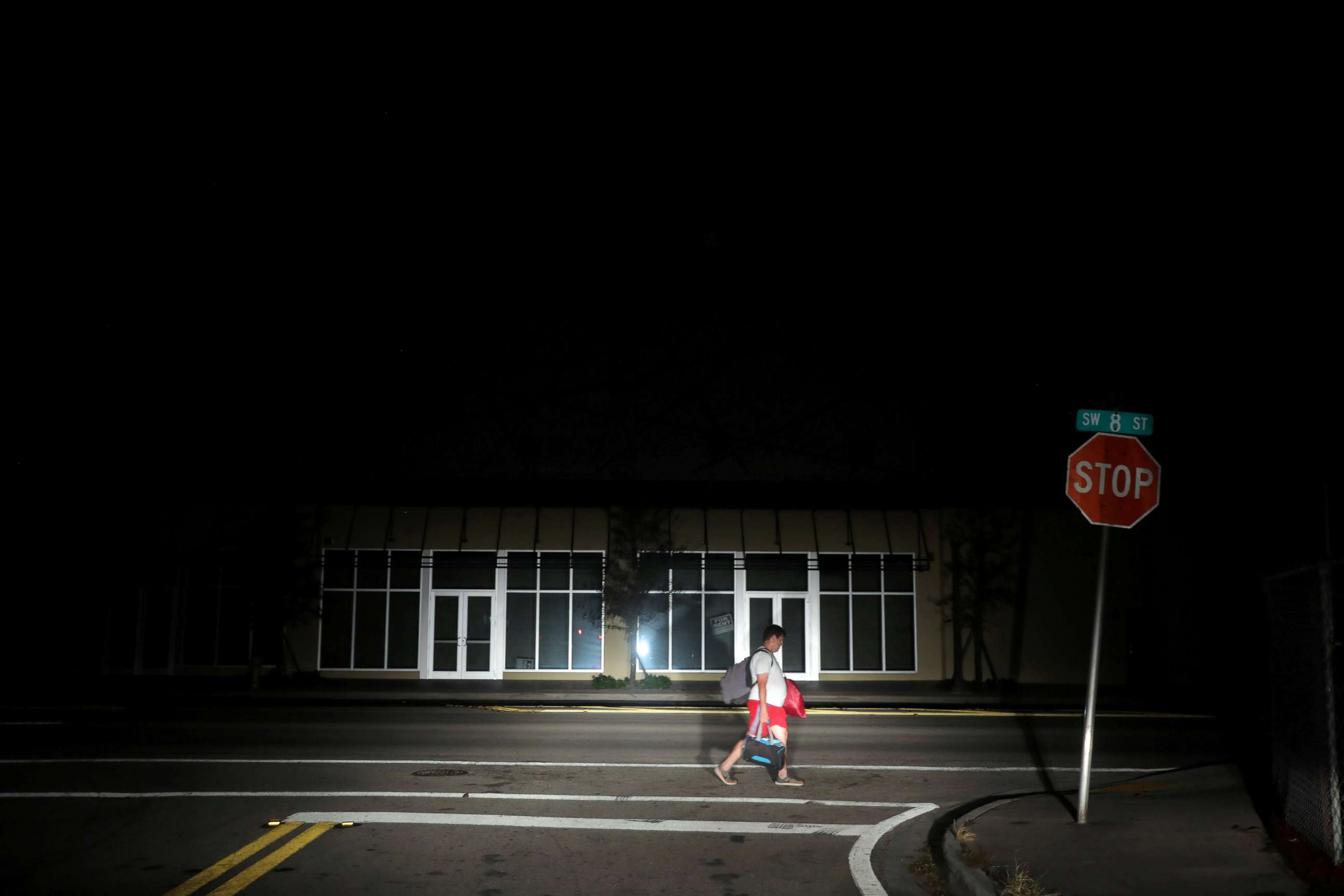 PHOTO: A man walks back home in the darkness as many areas of Miami still without electricity after Hurricane Irma strikes Florida, in Little Havana, Miami, Fla., Sept. 11, 2017. 