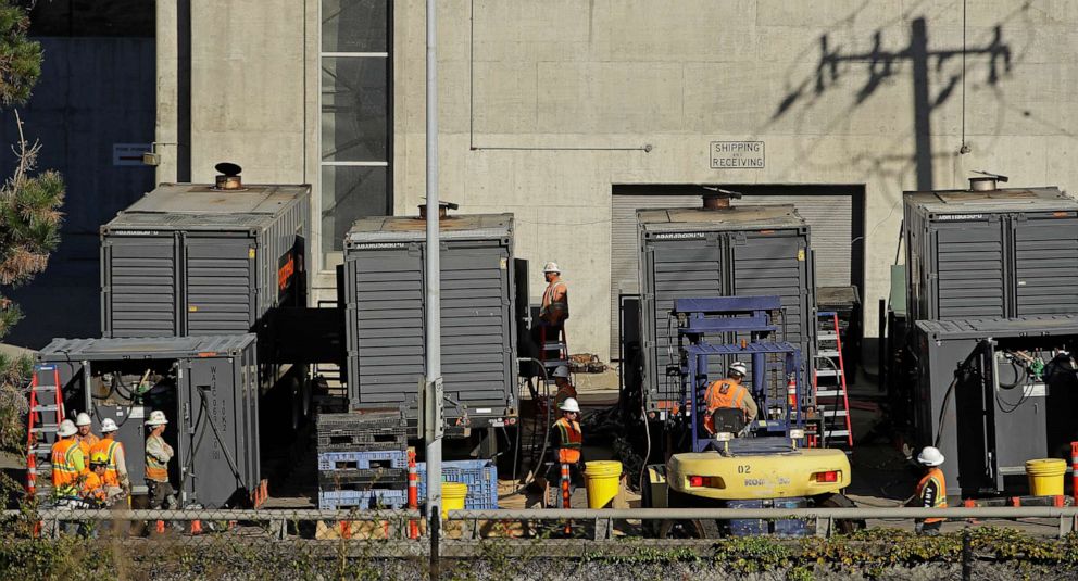 PHOTO:Crews work to connect generators in effort to keep the Caldecott Tunnel open to traffic during a possible power outage, Oct. 9, 2019, in Oakland, Calif.