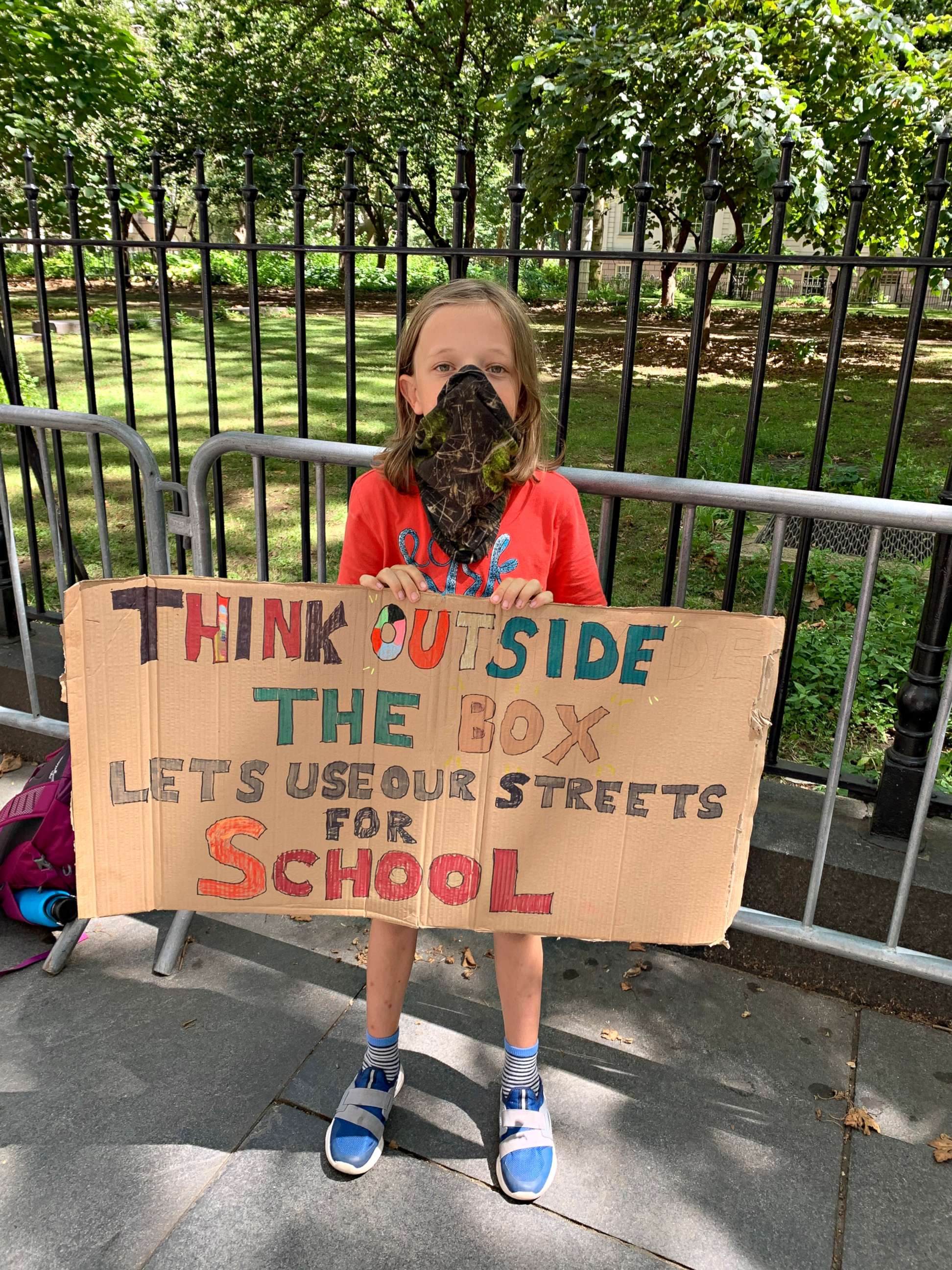 PHOTO: Fourth grader Conor Landauer holds a sign outside City Hall at a rally to demand street closures and park permits for New York City schools, Aug. 20, 2020.