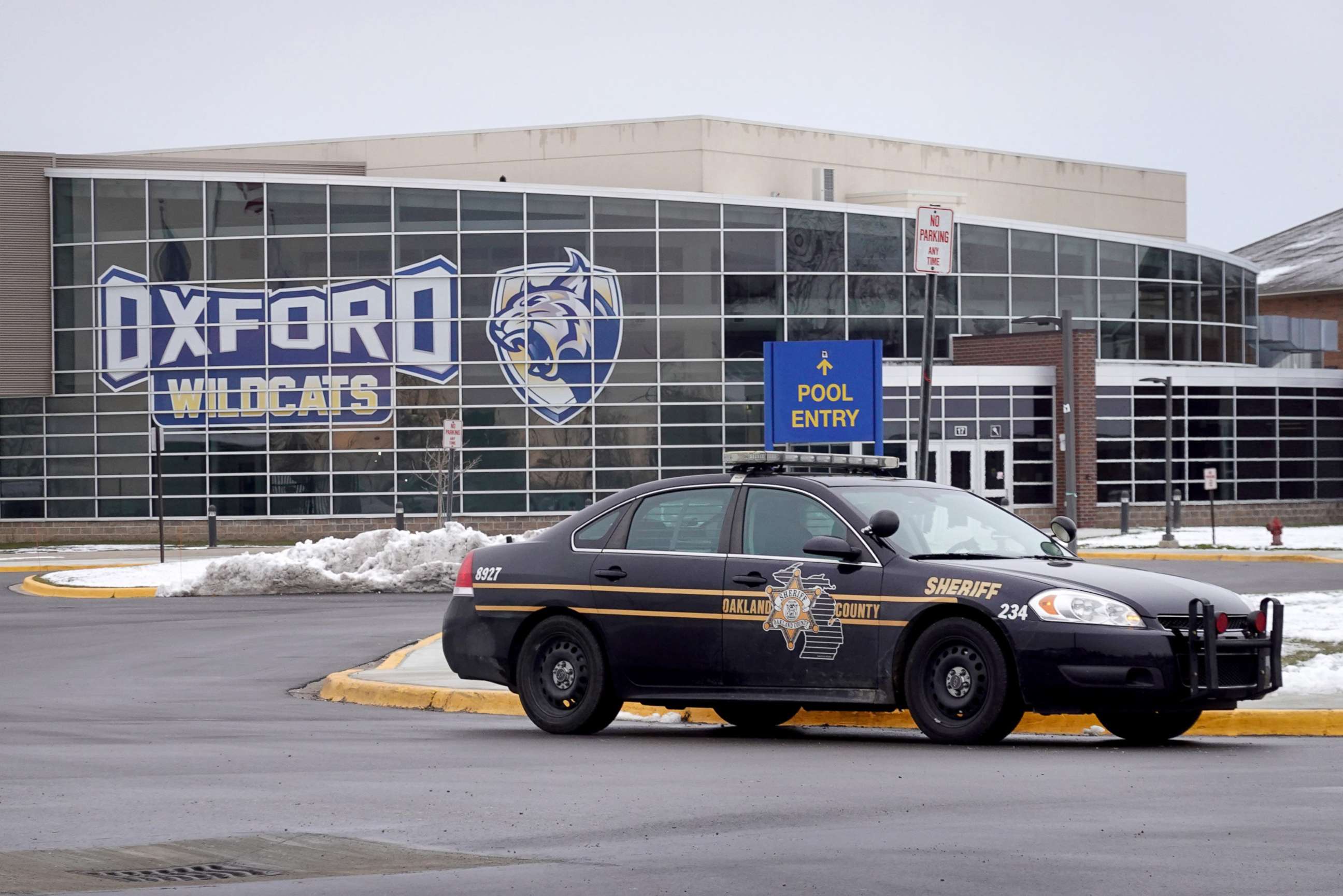 PHOTO: A police vehicle remains parked outside of Oxford High School after an active shooter incident in Oxford, Mich., Dec. 01, 2021.