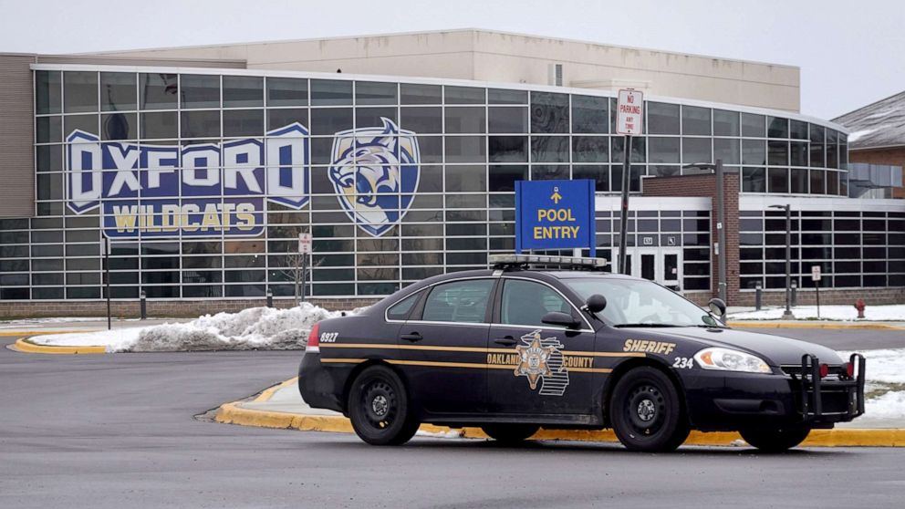 PHOTO: A police vehicle remains parked outside of Oxford High School after an active shooter incident in Oxford, Mich., Dec. 01, 2021.