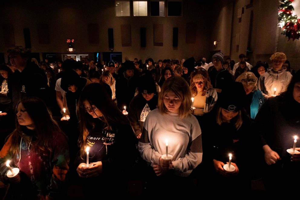 PHOTO: Students and community members gather for a candlelight prayer vigil at Bridgewood Church to pray for the community, a day after a deadly shooting at Oxford High School, in Clarkston, Michigan, Dec. 1, 2021.