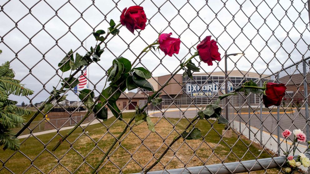 PHOTO: Four roses are placed on a fence to honor Hana St. Juliana, 14; Madisyn Baldwin, 17; Tate Myre, 16 and Justin Shilling, 17,  the four teens killed in last week's shooting, outside Oxford High School in Oxford, Mich., Dec. 7, 2021. 