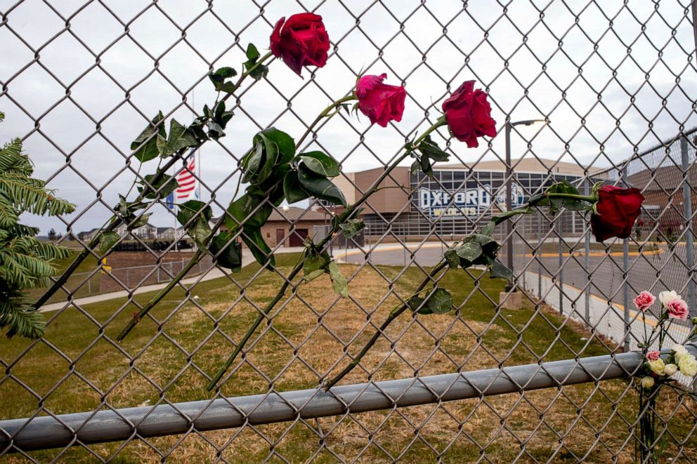 PHOTO: Four roses are placed on a fence to honor Hana St. Juliana, 14; Madisyn Baldwin, 17; Tate Myre, 16 and Justin Shilling, 17,  the four teens killed in last week's shooting, outside Oxford High School in Oxford, Mich., Dec. 7, 2021. 