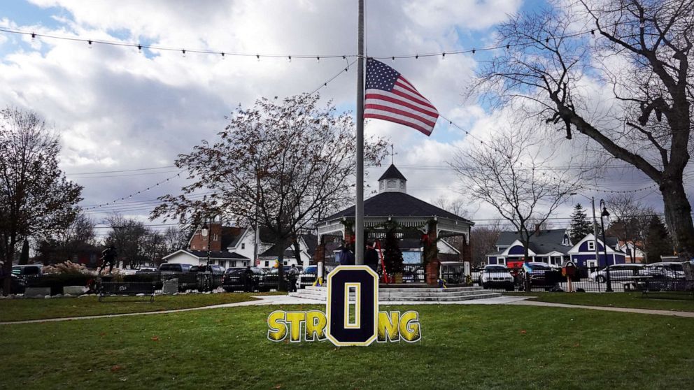 PHOTO: A flag flies at half mast in Centennial Park in honor of the students and staff killed and wounded in the November 30 shooting at Oxford High School, Dec. 2, 2021 in Oxford, Michigan.