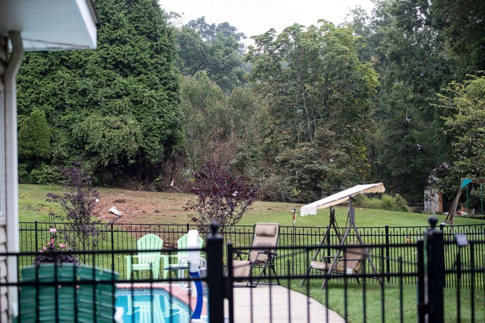 PHOTO: Debris from a small plane crash sets in backyards of a residential neighborhood in Upper Moreland, Pa., Thursday, Aug. 8, 2019.