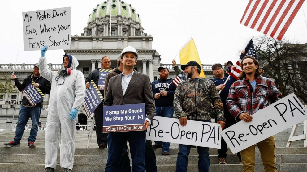 PHOTO: Protesters demonstrate at the state Capitol in Harrisburg, Pa., April 20, 2020, demanding that Gov. Tom Wolf reopen Pennsylvania's economy even as new social-distancing mandates took effect at stores and other commercial buildings.